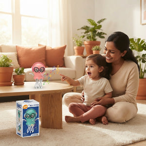 A South Asian mother and toddler watching a dancing jellyfish toy on a wooden table in a sunlit, terracotta and cream-toned r